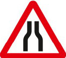 Road narrows on both sides