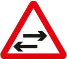 Two-way traffic crosses a one-way road